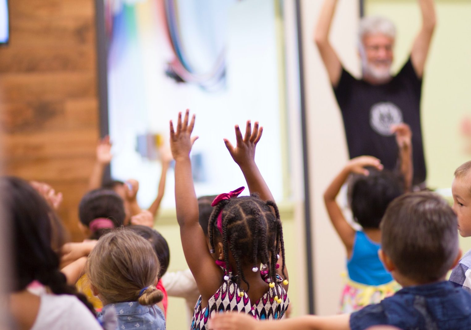 children lifting hands