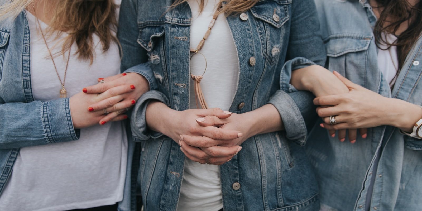 woman in blue denim jacket and white shirt